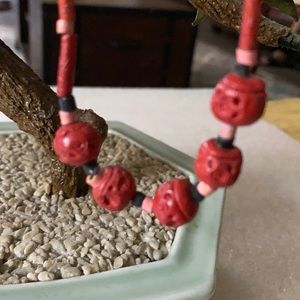 Antique engraved cinnabar necklace